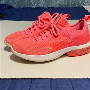 Nike shoes women’s size 9, the color is like a neon coral.